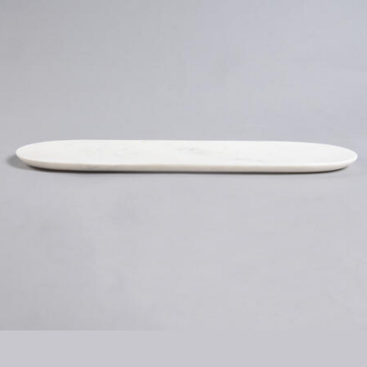long marble cheese tray on a gray background
