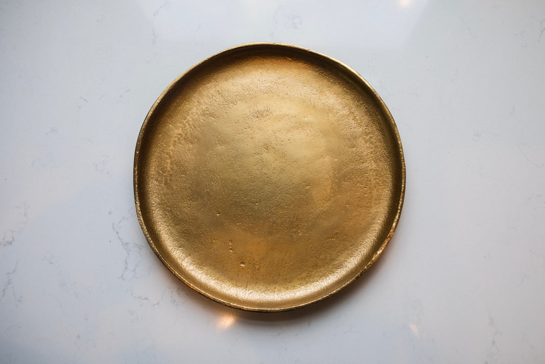 Gold plate on a light gray background